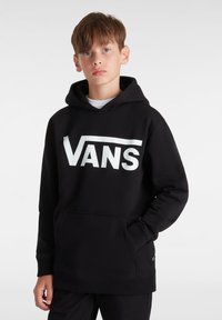 Sweat à capuche noir avec un logo Vans blanc sur le devant, fabriqué en tissu doux, doté d'une poche kangourou et d'une capuche avec cordon de serrage.