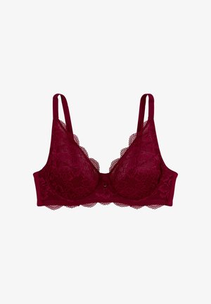 Soutien-gorge en dentelle d'un profond bourgogne avec des bords festonnés, des bonnets transparents et des bretelles réglables. Il présente un petit nœud décoratif au centre.