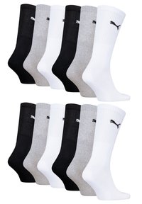 Set aus sechs Socken in Schwarz, Weiß und Grau. Material aus Baumwollgemisch mit gerippten Bündchen und einem kleinen Logo auf jeder Socke.