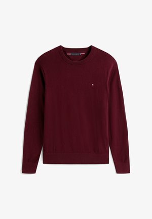 Maglione bordeaux a maniche lunghe realizzato in morbido tessuto a maglia. Presenta un collo a girocollo e un piccolo logo sul petto. Polsini e orlo a coste.