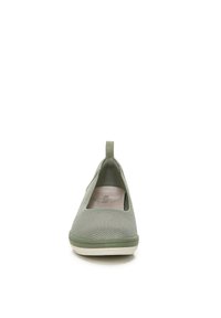 Green mesh slip-on shoe with a rounded toe, elastic side opening, padded insole, and a textured rubber sole.