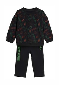 Čierny set s mikinou a nohavicami s pestrou grafickou potlačou znázorňujúcou postavy z Disney a športové prvky. Mikina má rebrované manžety a okolo krku.