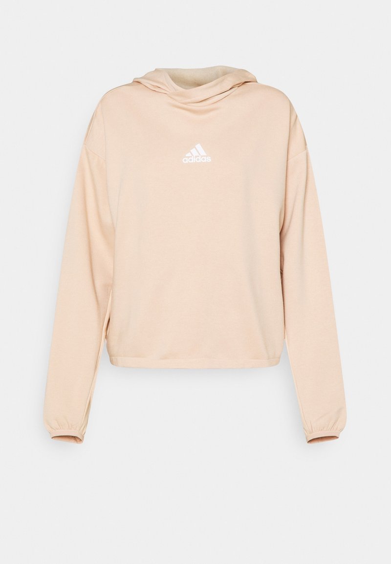 Hoodie court couleur pêche en matière douce, avec capuche à cordon de serrage et logo Adidas blanc sur la poitrine. Manches longues avec poignets élastiques.