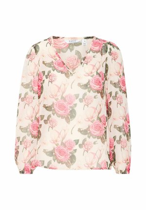 Blouse florale en tissu transparent présentant un décolleté en V, des manches longues et un motif de roses roses sur un fond clair. Poignets élastiques.