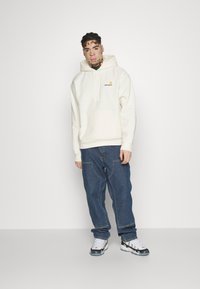 Carhartt WIP HOODED AMERICAN SCRIPT - Felpa con cappuccio - wax