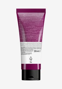 Paarse kunststof buis met zwarte basis, capaciteit van 200 ml. Tekst in meerdere talen op de achterkant, inclusief productinformatie en recycling symbolen.