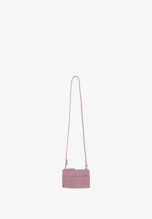 Pink corduroy crossbody bag with a long strap, zip closure, front pocket, and subtle logo detail. Compact rectangular shape.