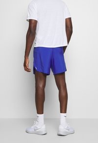 Nike Performance Träningsshorts - blue