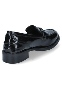 Black patent leather loafers with a slightly raised heel, featuring a flat toe, stitched accents, and a classic design.