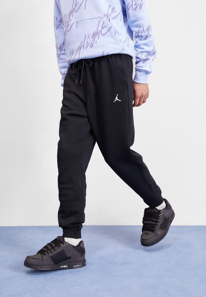 Jordan Pantaloni de trening - black/white