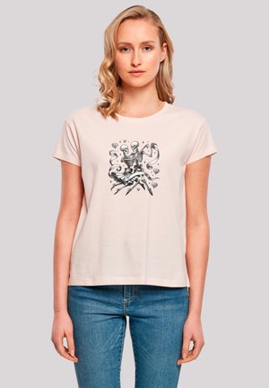 Light pink cotton t-shirt with a round neckline and short sleeves, featuring a black skeleton graphic in the center. Casual fit.