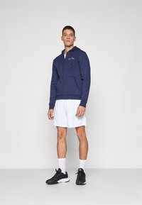 Sergio Tacchini CIPRESSO HOODIE SWEATER - Majica s kapuljačom i patentnim zatvaračem - navy/gardenia