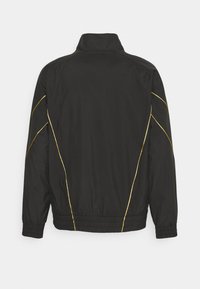 Puma ICONIC KING TRACK - Giacca sportiva - black