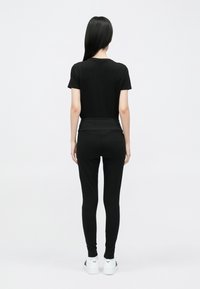 EA7 Emporio Armani Leggingek - Nadrágok - black/rose gold-coloured