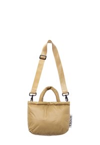 Padded beige bag with a smooth texture, dual short handles, and a detachable long strap. Features a logo tag on the side.