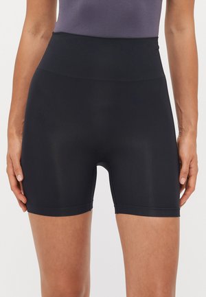 Black high-waisted shorts with a stretchy, smooth texture, featuring a mid-thigh length and a seamless design for comfort.