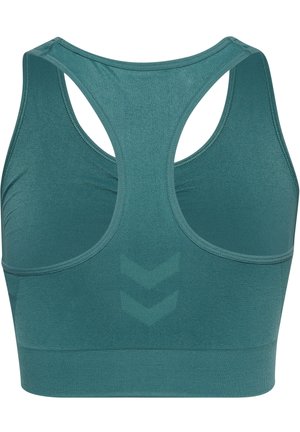 Teal sportsbh med racerback-design, der har en tekstureret overflade og chevronmønster på ryggen. Glat stof og elastisk bånd.