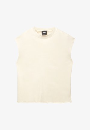 Bezramkowa bluzka w kolorze off-white, wykonana z bawełny. Charakteryzuje się okrągłym dekoltem i czystym, minimalistycznym wzornictwem z lekko opadającymi pachami. Miękka tekstura.