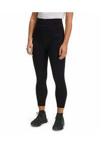 Leggings neri a vita alta realizzati in materiale elasticizzato, con un design elegante e dettagli discreti del marchio sulla vita.