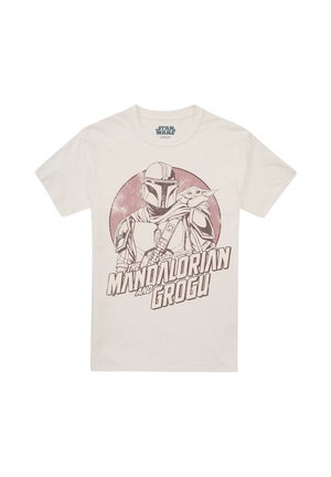Beige T-shirt with printed graphic of Mandalorian in armor holding Grogu, with text "The Mandalorian and Grogu" below.
