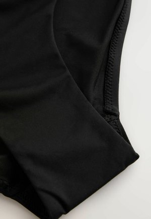 Svarta baddräktsbyxor i slät, stretchig tyg. Har hög midja och platta sömmar, med en ren och minimalistisk design.