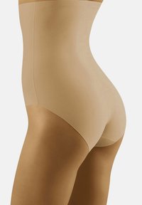 Bielizna wysoka w talii w odcieniu nude, wykonana z gładkiego materiału i bezszwowym designie, oferująca lekką kompresję i wyraźną sylwetkę.