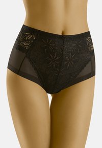 Culotte noire taille haute avec panneau supérieur en dentelle, côtés transparents, finition lisse, motifs floraux complexes et bordure festonnée.