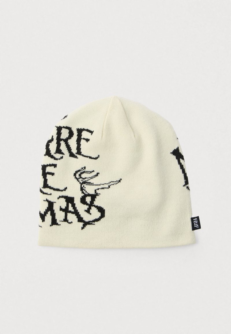 Πλεκτός σκούφος σε εκρού χρώμα με μαύρο γραφικό κείμενο και σχέδιο. Διαθέτει μαλακή υφή και μια μικρή ετ�ικέτα με το λογότυπο στο πλάι.