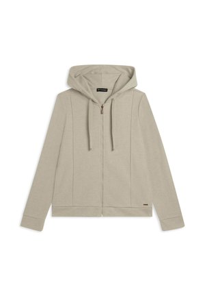 Felpa con zip color beige chiaro, dotata di cappuccio, realizzata in tessuto morbido. Presenta cuciture laterali e un piccolo etichetta con il marchio vicino all'orlo.