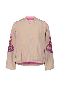 Lichte beige bomberjack met een rits aan de voorkant, roze voering en bloemachtige paillettendecoraties in roze en oranje op de mouwen.