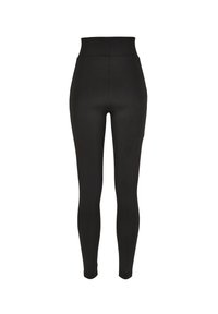 Collants noirs taille haute en matériau lisse avec une coupe ajustée, sans coutures ni motifs visibles.