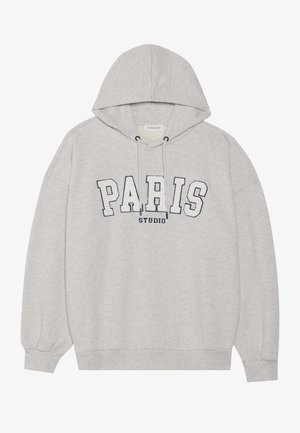 Gray hoodie made of soft fabric, featuring a front graphic that reads "PARIS STUDIO" in bold navy letters. Has a drawstring hood and ribbed cuffs.