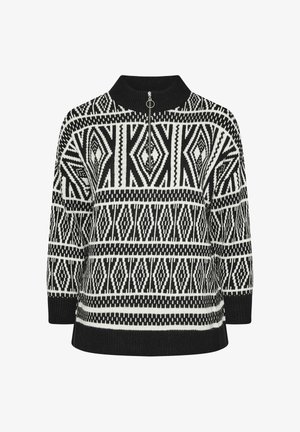 Suéter de punto en blanco y negro con un cuello alto, que presenta patrones geométricos y una cremallera de cuarto en el cuello.