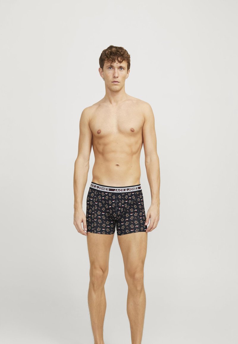 Schwarze Boxershorts mit floralem Muster, elastischem Bund mit dem Aufdruck "JACK & JONES", taillierte Passform, glattes Material und mittellange Schnittführung.