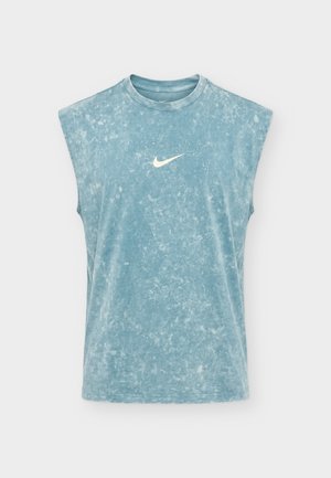 Sleeveless, acid-wash blue Nike tank top with a round neckline and white Nike swoosh logo centered on the chest.