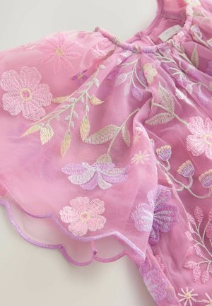 Pink embroidered floral dress with sheer fabric, scalloped hem, and intricate flower designs in various shades of pink and purple.