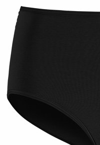 Zwarte hooggerokte onderbroeken van ribstof. Beschikt over een zachte tailleband en strakke randen zonder zichtbare hardware of patronen.