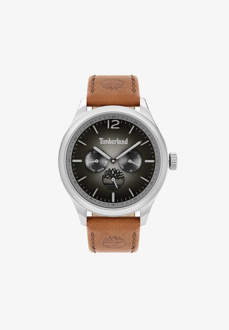 Timberlandi kell, millel on roostevabast terasest korpus, tumehall kellaseade, pruun nahast rihm ja eristuv logo kell 6 kohal. Omab päevade ja kuupäevade näidikuid.