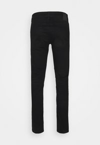 Pantaloni in denim nero con vestibilità slim, dotati di una vita classica, due tasche posteriori e dettagli di cucitura discreti.