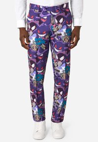Fialové nohavice s celoplošným potlačou rôznych karikatúrnych monštrík. Vyrobené z hladkej tkaniny s úzkym strihom.
