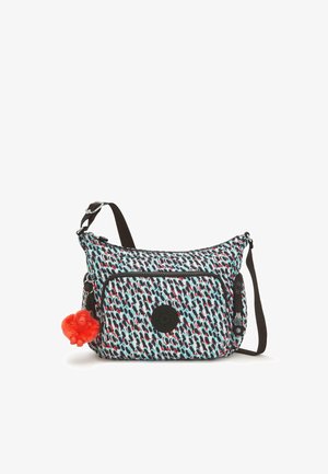 Borsa a tracolla di colore azzurro chiaro con un motivo astratto multicolore, dotata di una tasca frontale con zip e un portachiavi a forma di scimmia pelosa rossa. Accenti neri.