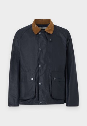 Granatowa woskowana kurtka z brązowym kołnierzem z sztruksu, z przodu zatrzaski oraz dwie duże kieszenie z patkami zapinane na zatrzaski.