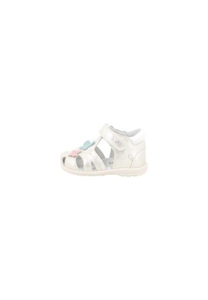 Sandalo bianco per bambino con cinturino in velcro e ritagli, decorato con decorazioni floreali rosa e blu sul lato.