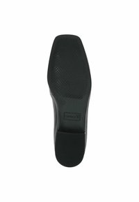 Semelle de chaussure noire avec surface en caoutchouc texturée, forme plate et petit talon. Comprend une étiquette indiquant "Caprice" et pointure "37".