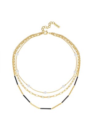Drie laag gouden ketting met kleine witte parels en zwarte staafaccenten, met gouden sluiting en verstelbare ketting.
