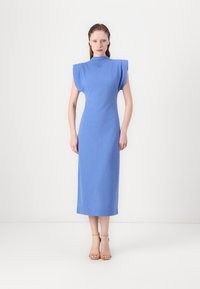 Fitted, mid-length dress in light blue fabric with shoulder accents and a high neck. Smooth texture, minimalistic design, and no patterns.