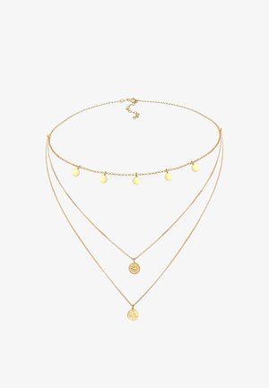 Collier en or à trois couches avec des pendentifs circulaires et de petits disques. Les chaînes varient en longueur, mettant en avant une texture et un design délicats.