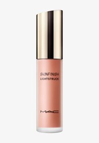 MAC Skinfinish Lightstruck flydende highlighter i en frostet tube med en skinnende guldhætte på en hvid baggrund.
