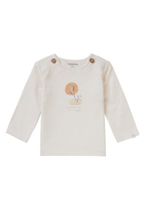 T-shirt pour tout-petit couleur crème à manches longues avec des accents de boutons en bois à l'épaule. L'avant présente un design graphique avec des éléments orange et noir.