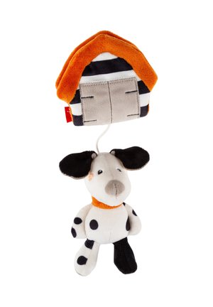 Soft plush toy dog with black spots and one black leg, attached by string to a plush doghouse with orange roof and striped walls.